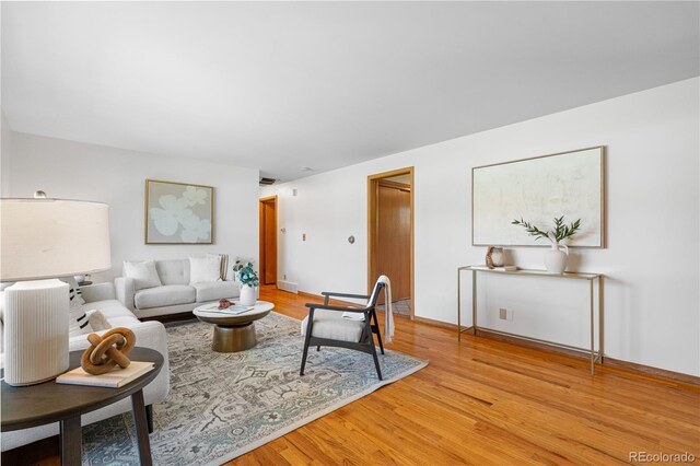 7135 S Sherman St, Centennial, CO 80122 - living room with light wood-style flooring and baseboards