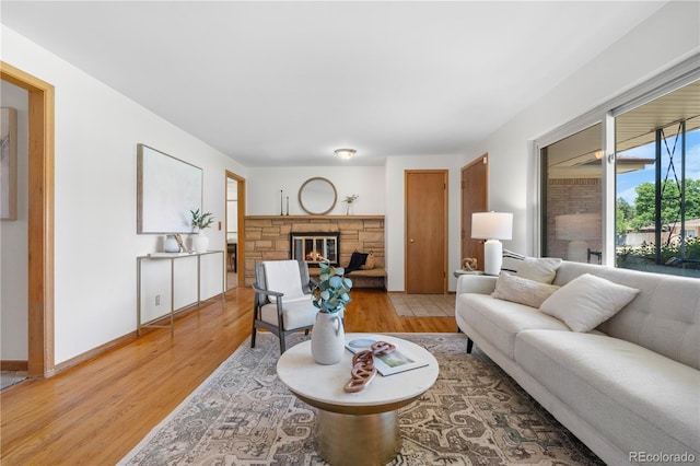 7135 S Sherman St, Centennial, CO 80122 - living area with light wood-type flooring and a fireplace