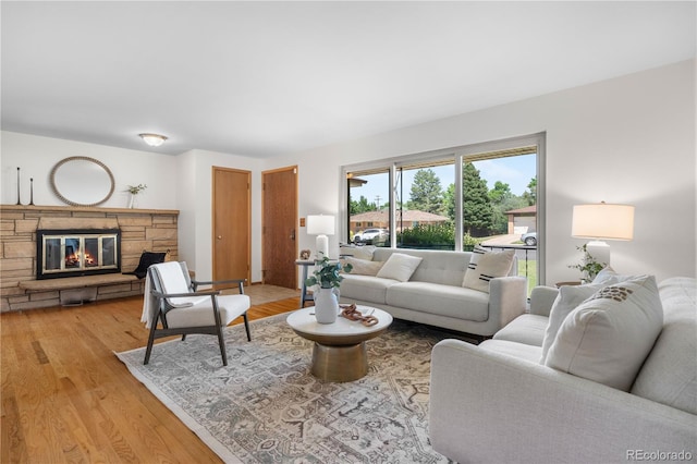 7135 S Sherman St, Centennial, CO 80122 - living area featuring light wood-style flooring and a fireplace