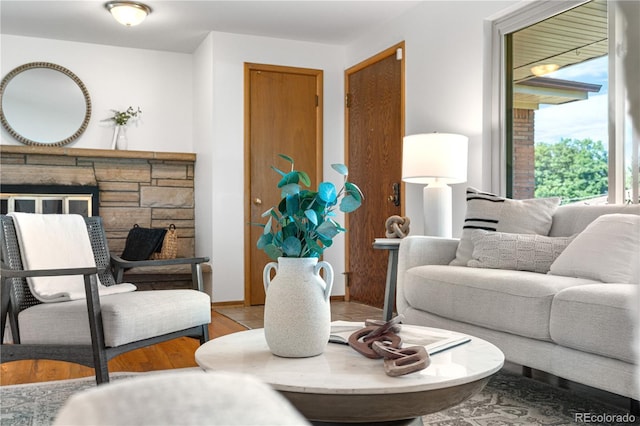 7135 S Sherman St, Centennial, CO 80122 - living area featuring wood finished floors and a stone fireplace