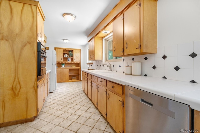 7135 S Sherman St, Centennial, CO 80122 - kitchen with dishwasher, decorative backsplash, freestanding refrigerator, and light tile patterned floors