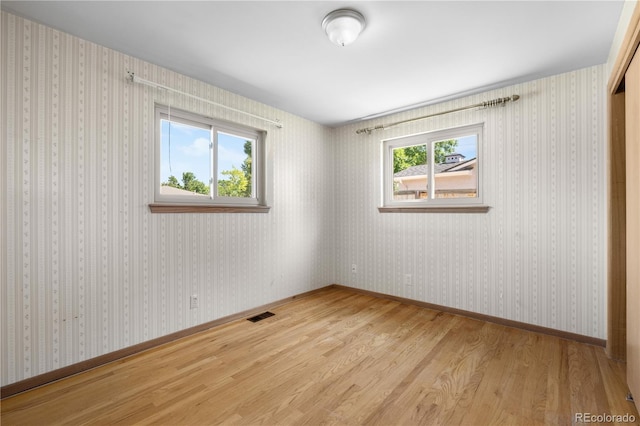 7135 S Sherman St, Centennial, CO 80122 - spare room featuring wood finished floors and baseboards