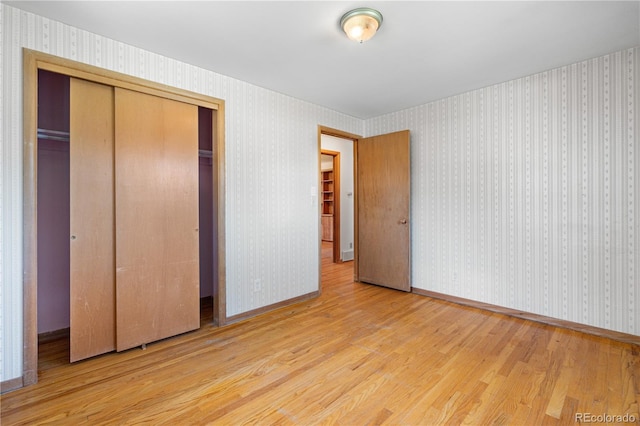 7135 S Sherman St, Centennial, CO 80122 - unfurnished bedroom featuring wood finished floors and a closet