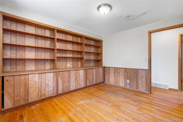 7135 S Sherman St, Centennial, CO 80122 - spare room with light wood-style floors and wooden walls