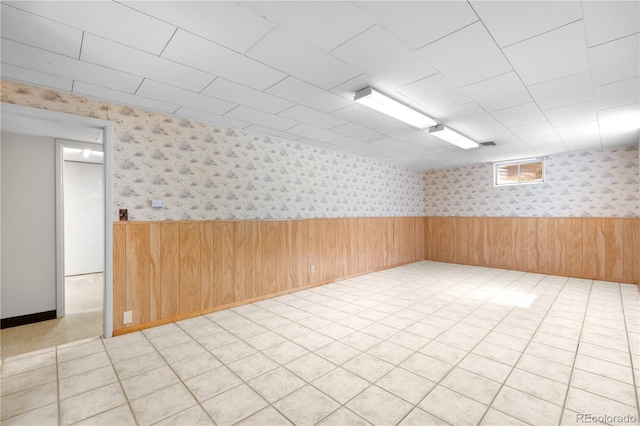 7135 S Sherman St, Centennial, CO 80122 - spare room with wainscoting, wallpapered walls, and wood walls