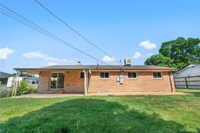 7135 S Sherman St, Centennial, CO 80122 - rear view of property with brick siding and a patio