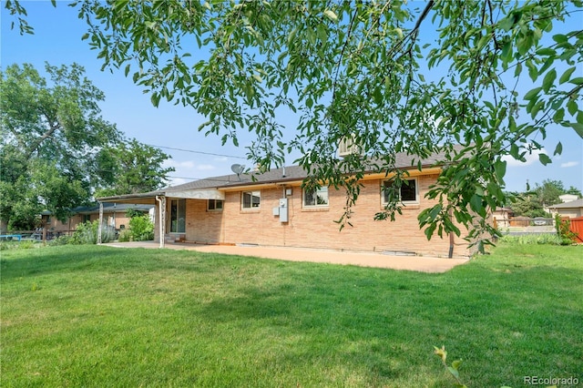7135 S Sherman St, Centennial, CO 80122 - back of house featuring brick siding and a patio