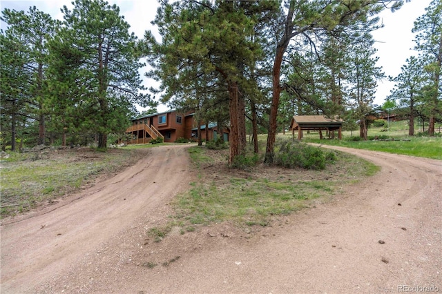 917 Bluebird Ln, Bailey, CO 80421 - view of front of home featuring dirt driveway and stairs