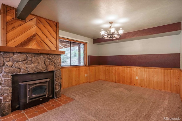 917 Bluebird Ln, Bailey, CO 80421 - unfurnished dining area featuring wainscoting, wood walls, a chandelier, and carpet floors