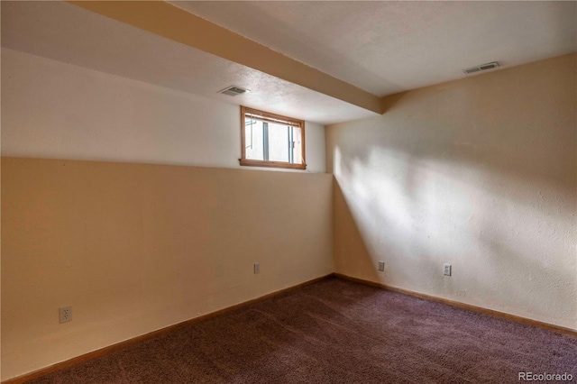 917 Bluebird Ln, Bailey, CO 80421 - below grade area with dark carpet and baseboards