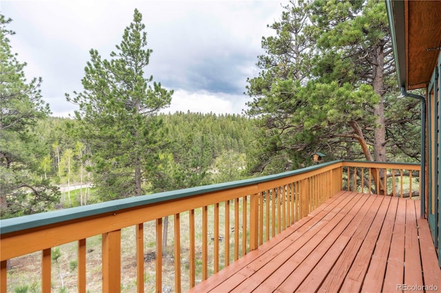 917 Bluebird Ln, Bailey, CO 80421 - wooden deck with a view of trees
