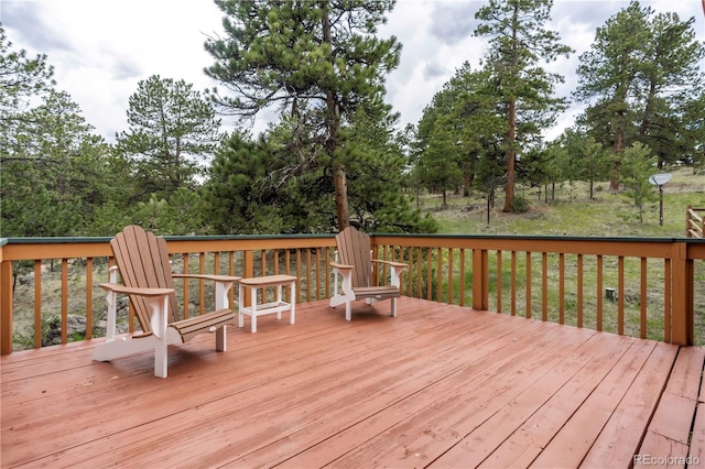 917 Bluebird Ln, Bailey, CO 80421 - wooden terrace with view of scattered trees