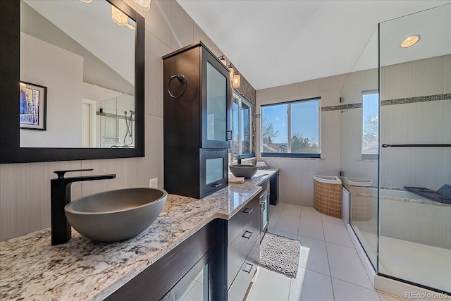 10127 W 100th Ct, Westminster, CO 80021 - bathroom with a shower stall, tile patterned flooring, and double vanity