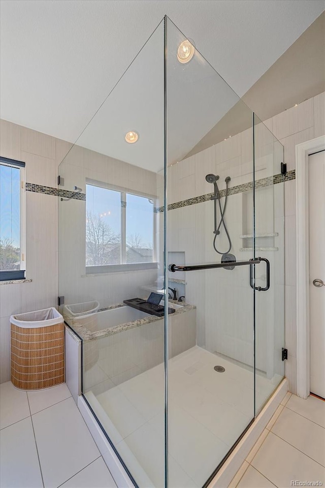 10127 W 100th Ct, Westminster, CO 80021 - bathroom with tile patterned floors, a stall shower, and a bath