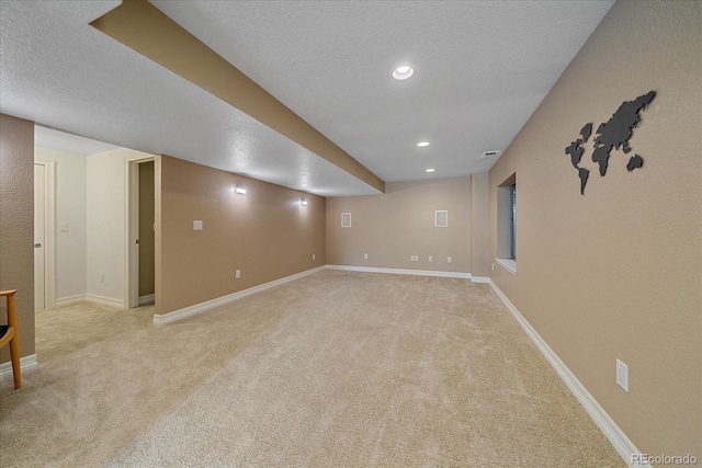 10127 W 100th Ct, Westminster, CO 80021 - finished basement featuring light carpet, a textured ceiling, baseboards, and recessed lighting