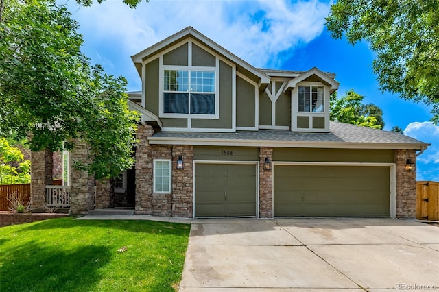 1588 W 111th Ave, Northglenn, CO 80234 - tudor house featuring stucco siding, concrete driveway, roof with shingles, and stone siding