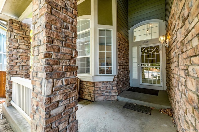 1588 W 111th Ave, Northglenn, CO 80234 - property entrance featuring a porch and stone siding