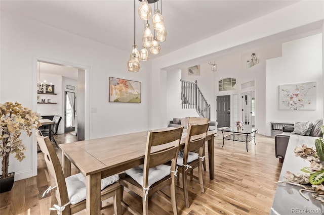 1588 W 111th Ave, Northglenn, CO 80234 - dining room with stairway and light wood finished floors