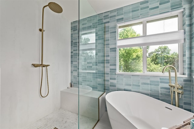 1588 W 111th Ave, Northglenn, CO 80234 - bathroom with a shower with shower door, a freestanding bath, and tile walls