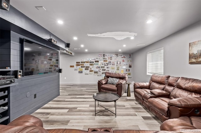 1588 W 111th Ave, Northglenn, CO 80234 - living area featuring light wood finished floors and recessed lighting