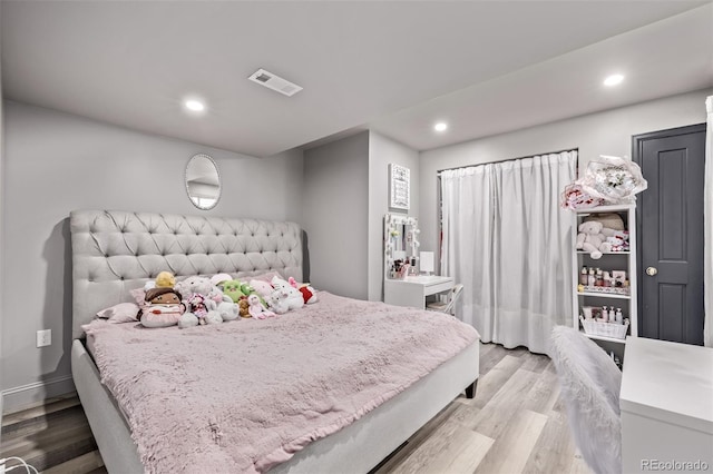 1588 W 111th Ave, Northglenn, CO 80234 - bedroom featuring light wood finished floors and recessed lighting