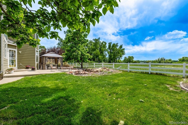1588 W 111th Ave, Northglenn, CO 80234 - fenced backyard with a gazebo and a patio