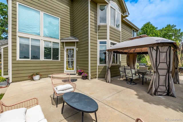 1588 W 111th Ave, Northglenn, CO 80234 - view of patio / terrace featuring a gazebo and outdoor dining area