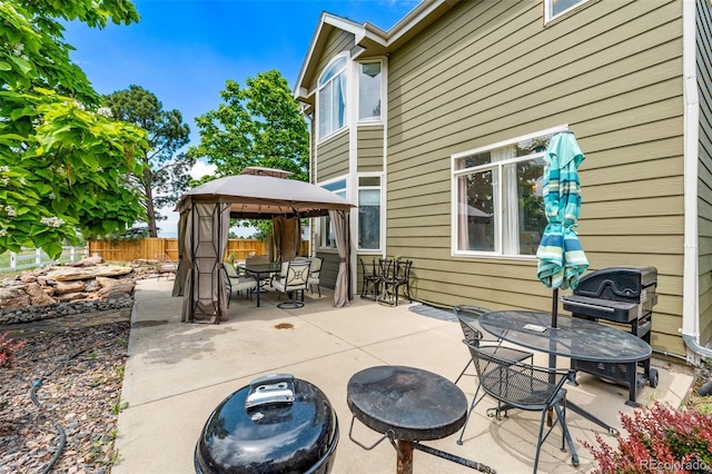 1588 W 111th Ave, Northglenn, CO 80234 - view of patio / terrace with outdoor dining space, a gazebo, and area for grilling