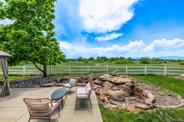 1588 W 111th Ave, Northglenn, CO 80234 - view of patio featuring a view of countryside