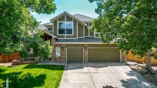 1588 W 111th Ave, Northglenn, CO 80234 - view of front of house featuring concrete driveway, a shingled roof, a garage, stone siding, and stucco siding