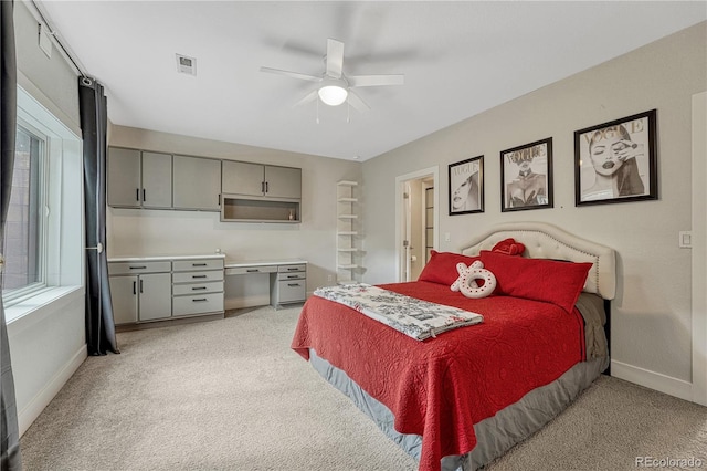 1915 Hunters Point Ln, Colorado Springs, CO 80919 - bedroom with light carpet and a ceiling fan