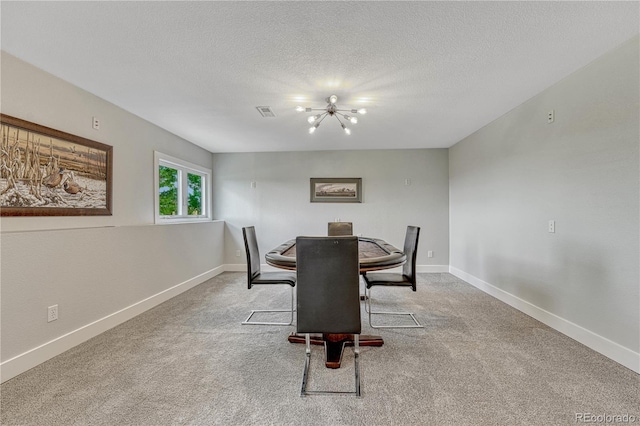 1915 Hunters Point Ln, Colorado Springs, CO 80919 - carpeted dining space featuring a chandelier and a textured ceiling