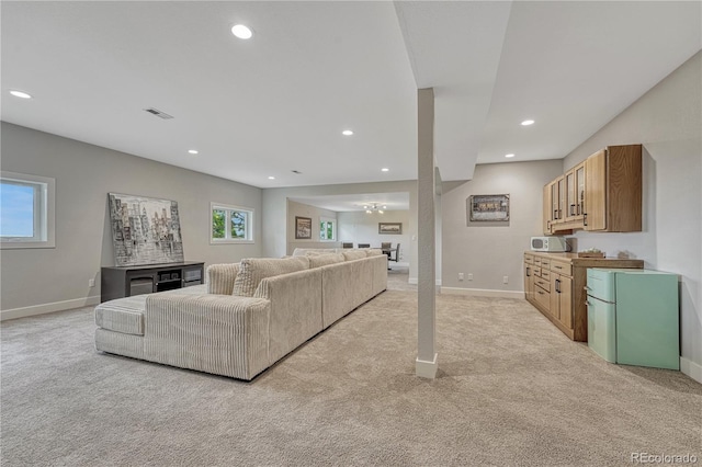 1915 Hunters Point Ln, Colorado Springs, CO 80919 - living area with light carpet, recessed lighting, and a chandelier