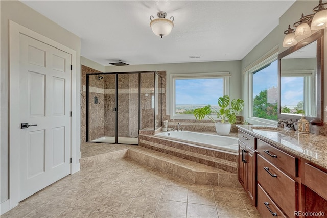1915 Hunters Point Ln, Colorado Springs, CO 80919 - bathroom with a shower stall, vanity, and a bath