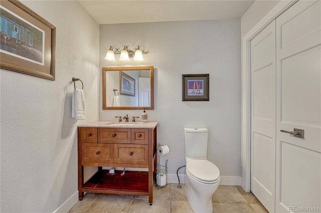 1915 Hunters Point Ln, Colorado Springs, CO 80919 - bathroom with vanity, tile patterned flooring, and a textured wall