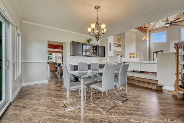 1915 Hunters Point Ln, Colorado Springs, CO 80919 - dining area with a chandelier, dark wood finished floors, and vaulted ceiling