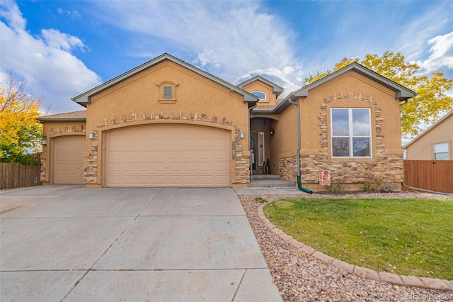 view of front of home featuring a garage and a front lawn