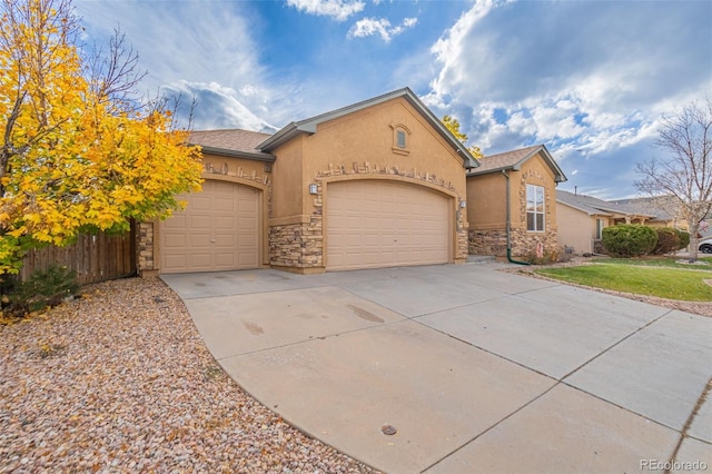 view of front of home with a garage and a front yard