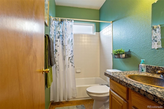 full bathroom with hardwood / wood-style flooring, shower / tub combo with curtain, vanity, and toilet