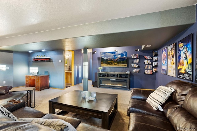 carpeted living room featuring a textured ceiling