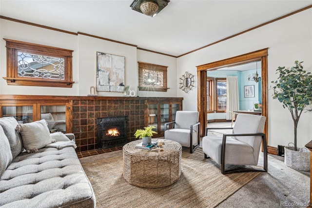 living room featuring a tiled fireplace and ornamental molding