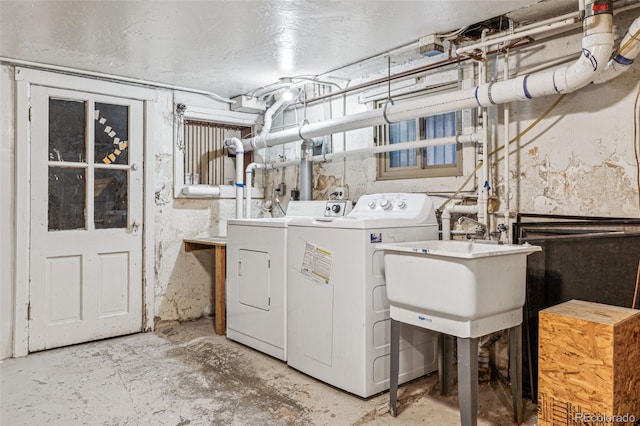 laundry room featuring washer and dryer and sink