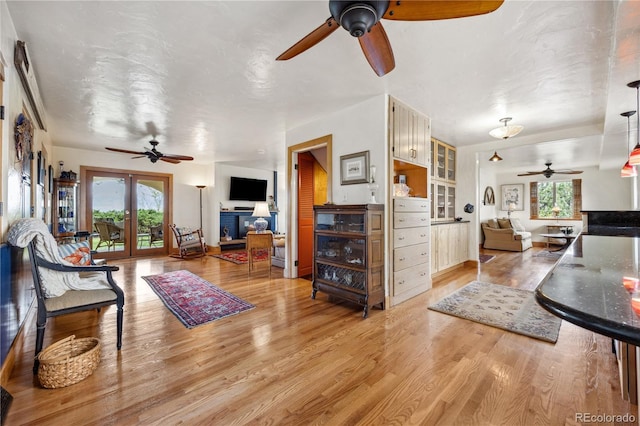 1069 Crestmoor Dr, Boulder, CO 80303 - living room featuring a ceiling fan, light wood-style floors, and a fireplace