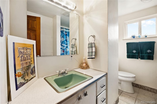 1069 Crestmoor Dr, Boulder, CO 80303 - full bath with vanity, toilet, tile patterned flooring, and baseboards