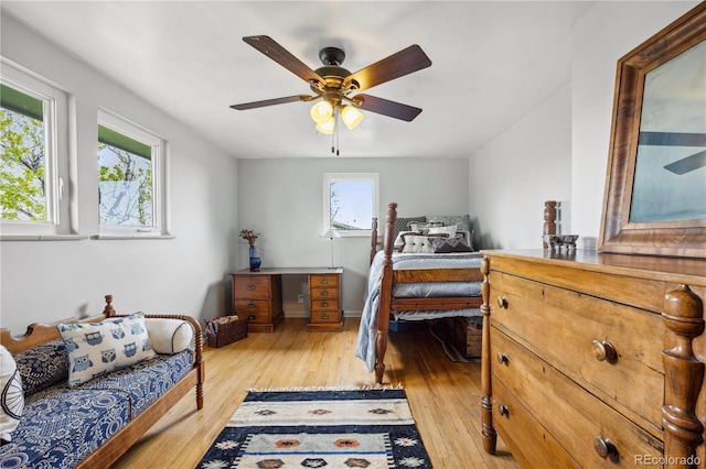 1069 Crestmoor Dr, Boulder, CO 80303 - bedroom with multiple windows, light wood-style floors, and a ceiling fan