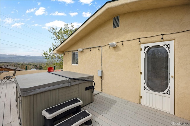 1069 Crestmoor Dr, Boulder, CO 80303 - deck with a hot tub and a mountain view