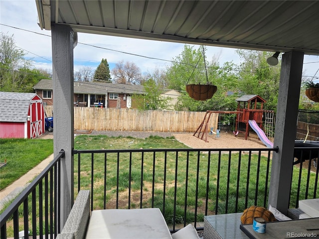 465 Salem St, Aurora, CO 80011 - view of yard featuring a storage unit, a playground, and an outbuilding