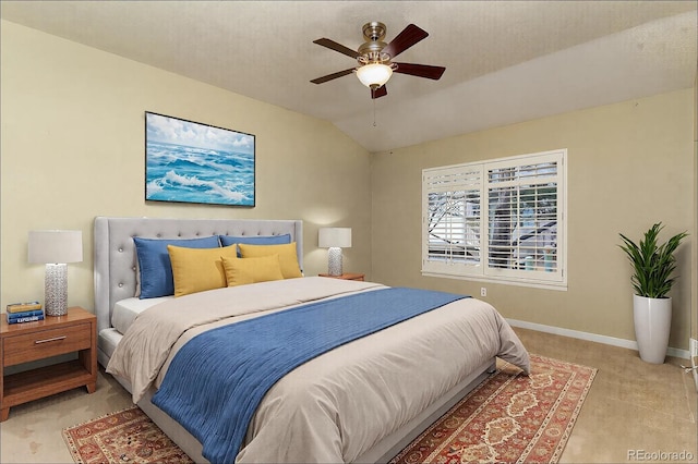 bedroom with lofted ceiling, ceiling fan, and baseboards