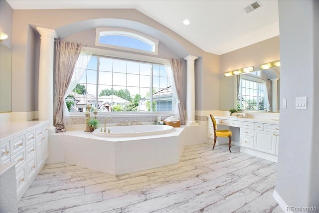 6254 S Riviera Ct, Aurora, CO 80016 - bathroom featuring plenty of natural light, vanity, a bath, ornate columns, and vaulted ceiling