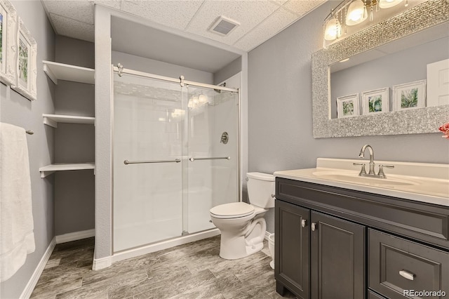6254 S Riviera Ct, Aurora, CO 80016 - full bath with toilet, a stall shower, vanity, a drop ceiling, and baseboards